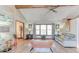 Spacious living room showcasing hardwood floors, large windows, and comfortable seating arrangement at 730 Ponderosa Ct, Fayetteville, GA 30214