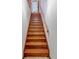 Wooden staircase with handrail leading to upper level of home at 730 Ponderosa Ct, Fayetteville, GA 30214