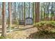 Backyard shed for storing lawn care items and tools in a wooded lot at 730 Ponderosa Ct, Fayetteville, GA 30214