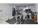 Finished basement featuring workout equipment and tile flooring with ample space for activities at 105 Jefferson Cir, Sandy Springs, GA 30328