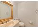 Elegant bathroom with a stylish marble sink, gold-framed mirror, and modern fixtures at 105 Jefferson Cir, Sandy Springs, GA 30328