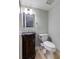 Stylish powder room with an ornate vanity, custom mirror and ample lighting at 105 Jefferson Cir, Sandy Springs, GA 30328