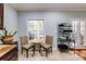 Bright breakfast nook features a cozy table setting, natural light, and easy access to the outdoors at 105 Jefferson Cir, Sandy Springs, GA 30328