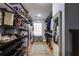 Walk-in closet featuring shelving and storage for shoes and clothing at 105 Jefferson Cir, Sandy Springs, GA 30328
