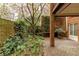 Private courtyard with lush greenery, ivy-covered walls, and a serene outdoor setting at 105 Jefferson Cir, Sandy Springs, GA 30328