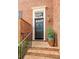 Elegant brick home featuring a stately front door with decorative trim and manicured landscaping at 105 Jefferson Cir, Sandy Springs, GA 30328