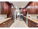 A modern kitchen with stainless steel appliances, granite countertops, and warm, inviting cabinetry at 105 Jefferson Cir, Sandy Springs, GA 30328