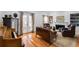 Cozy living room features hardwood floors, a fireplace, and french doors leading to the outside at 105 Jefferson Cir, Sandy Springs, GA 30328