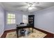 Bright office space with hardwood floors, natural light, a desk, and bookshelves at 105 Jefferson Cir, Sandy Springs, GA 30328
