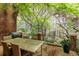 Outdoor deck features a dining set and lush green surroundings, ideal for al fresco dining at 105 Jefferson Cir, Sandy Springs, GA 30328