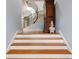 Beautiful staircase with hardwood steps, white risers, and a curved wrought iron railing at 105 Jefferson Cir, Sandy Springs, GA 30328