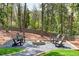 Beautiful backyard featuring a cozy firepit with comfortable seating and gravel at 1254 Moores Mill Nw Rd, Atlanta, GA 30327