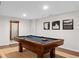 Basement game room features a pool table and cue storage for entertaining at 1254 Moores Mill Nw Rd, Atlanta, GA 30327