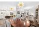 Large dining area with views to the living room, hardwood floors and light fixtures at 1254 Moores Mill Nw Rd, Atlanta, GA 30327