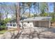 Charming home exterior with a driveway, back deck, and well maintained lawn at 1254 Moores Mill Nw Rd, Atlanta, GA 30327
