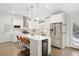 Contemporary kitchen featuring white cabinets, an island with seating, and stainless steel appliances at 1254 Moores Mill Nw Rd, Atlanta, GA 30327