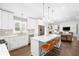 Open kitchen with island, stainless steel appliances, and hardwood floors at 1254 Moores Mill Nw Rd, Atlanta, GA 30327