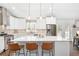 Updated kitchen with white cabinets, stainless steel appliances, an island with seating at 1254 Moores Mill Nw Rd, Atlanta, GA 30327