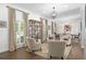 Open-concept living room with hardwood floors, natural light, and views to the dining area at 1254 Moores Mill Nw Rd, Atlanta, GA 30327