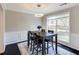 The bright dining room is decorated with wainscotting at 1855 Keswick Place Dr, Lawrenceville, GA 30043