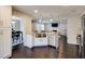 Modern kitchen features stainless steel appliances, a large sink, and granite countertops at 1855 Keswick Place Dr, Lawrenceville, GA 30043