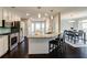 Modern kitchen featuring stainless steel appliances, granite countertops, and a breakfast bar at 1855 Keswick Place Dr, Lawrenceville, GA 30043