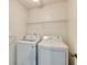 The laundry room is equipped with a modern washer and dryer at 1855 Keswick Place Dr, Lawrenceville, GA 30043