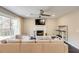 Cozy living room features a fireplace, TV, and a large comfortable sectional sofa at 1855 Keswick Place Dr, Lawrenceville, GA 30043