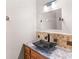 Modern bathroom with unique dark sink, mosaic tile backsplash, and granite countertop at 35 Tracechain, Stockbridge, GA 30281