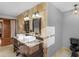 Elegant bathroom features a dual sink vanity with marble countertop and dark wood cabinets at 35 Tracechain, Stockbridge, GA 30281