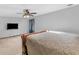 Main bedroom with light grey walls, ceiling fan, and decorative bed frame at 35 Tracechain, Stockbridge, GA 30281