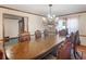 Dining room with a large table set, hardwood floors, and decorative wainscoting at 35 Tracechain, Stockbridge, GA 30281