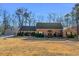 Well-kept home with an attached garage, lush bushes, and a spacious front yard at 35 Tracechain, Stockbridge, GA 30281
