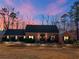 Charming brick home with well-maintained landscaping, mature trees, and inviting front entrance at 35 Tracechain, Stockbridge, GA 30281