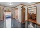 Inviting foyer with glossy tiled flooring, decorative wood trim, and chandelier lit dining room at 35 Tracechain, Stockbridge, GA 30281