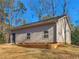 Detached garage shows landscaping and lawn at 35 Tracechain, Stockbridge, GA 30281