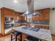 Beautiful kitchen with stainless steel vent hood and granite countertop island with seating at 35 Tracechain, Stockbridge, GA 30281