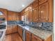 Granite countertops and backsplash with stainless steel appliances in the large kitchen at 35 Tracechain, Stockbridge, GA 30281