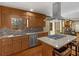 Kitchen features a gas cooktop island, stainless steel appliances, and lots of cabinets at 35 Tracechain, Stockbridge, GA 30281