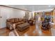 Bright and open living room adjacent to the kitchen, featuring hardwood floors and comfortable seating at 35 Tracechain, Stockbridge, GA 30281