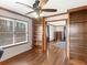 Bright living room featuring wood floors, custom built-in bookshelves, and a ceiling fan at 35 Tracechain, Stockbridge, GA 30281