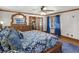 Elegant main bedroom boasts stylish decor, hardwood floors, and access to an adjacent room at 35 Tracechain, Stockbridge, GA 30281