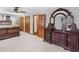 Main bedroom featuring hardwood trim, dresser, and neutral-colored walls at 35 Tracechain, Stockbridge, GA 30281