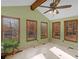 Bright sun room with tile floors, ceiling fan, and large windows at 35 Tracechain, Stockbridge, GA 30281