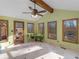 Cozy sun room features vaulted ceilings, tile floors, and large windows at 35 Tracechain, Stockbridge, GA 30281