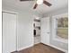 Bedroom boasts a ceiling fan, hardwood flooring, and neutral paint at 5074 Park Ave, Forest Park, GA 30297