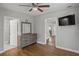 Bedroom with hardwood floors, neutral walls, and glimpses into the bathroom and hallway at 5074 Park Ave, Forest Park, GA 30297