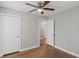 Bedroom features hardwood floors, ceiling fan, and neutral paint at 5074 Park Ave, Forest Park, GA 30297
