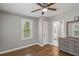 This bedroom features a ceiling fan and natural light at 5074 Park Ave, Forest Park, GA 30297