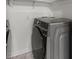 Laundry room showcasing a new grey washer and dryer set at 5074 Park Ave, Forest Park, GA 30297